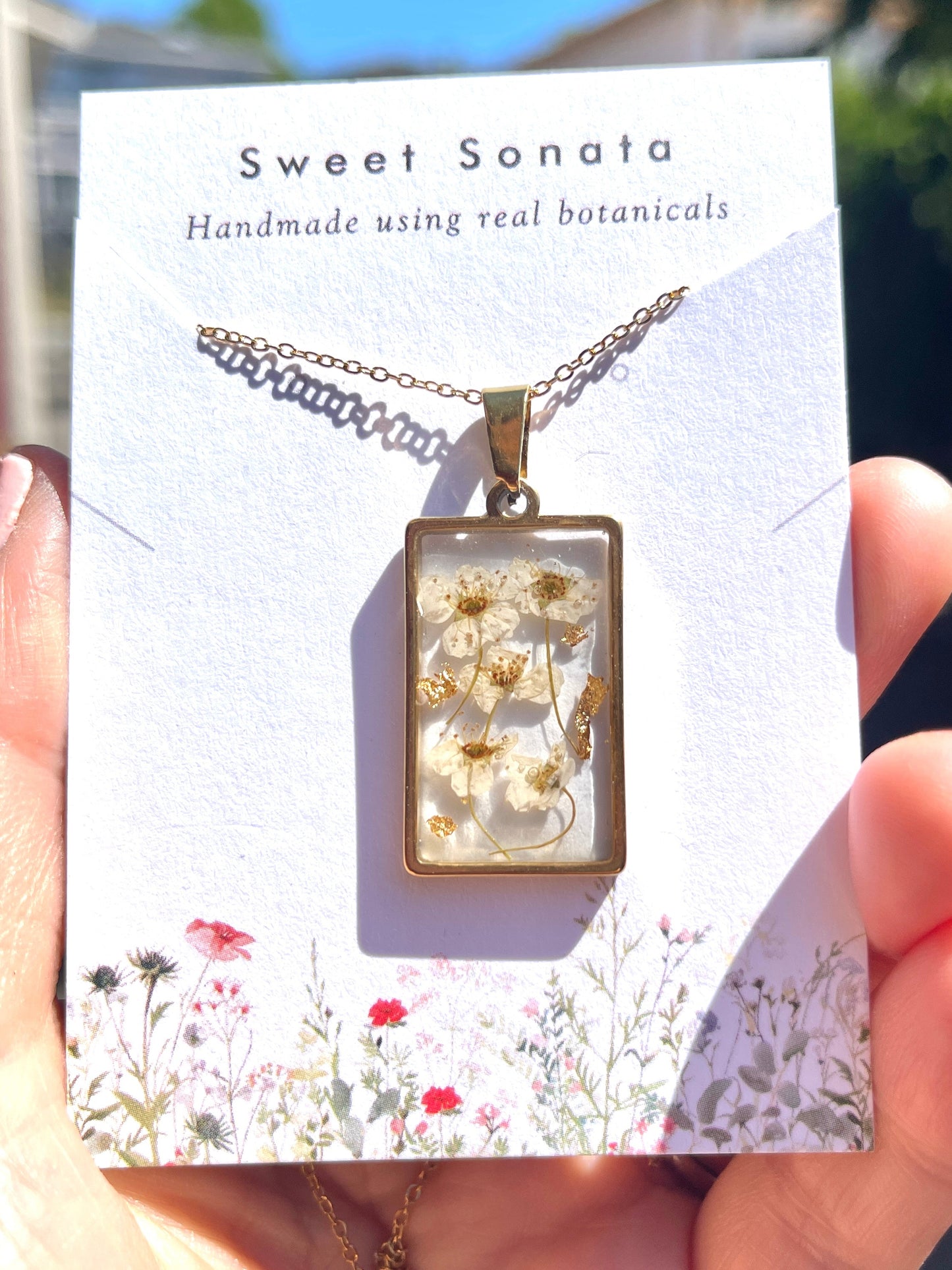 White narcissus flowers with gold flakes