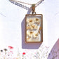 White narcissus flowers with gold flakes