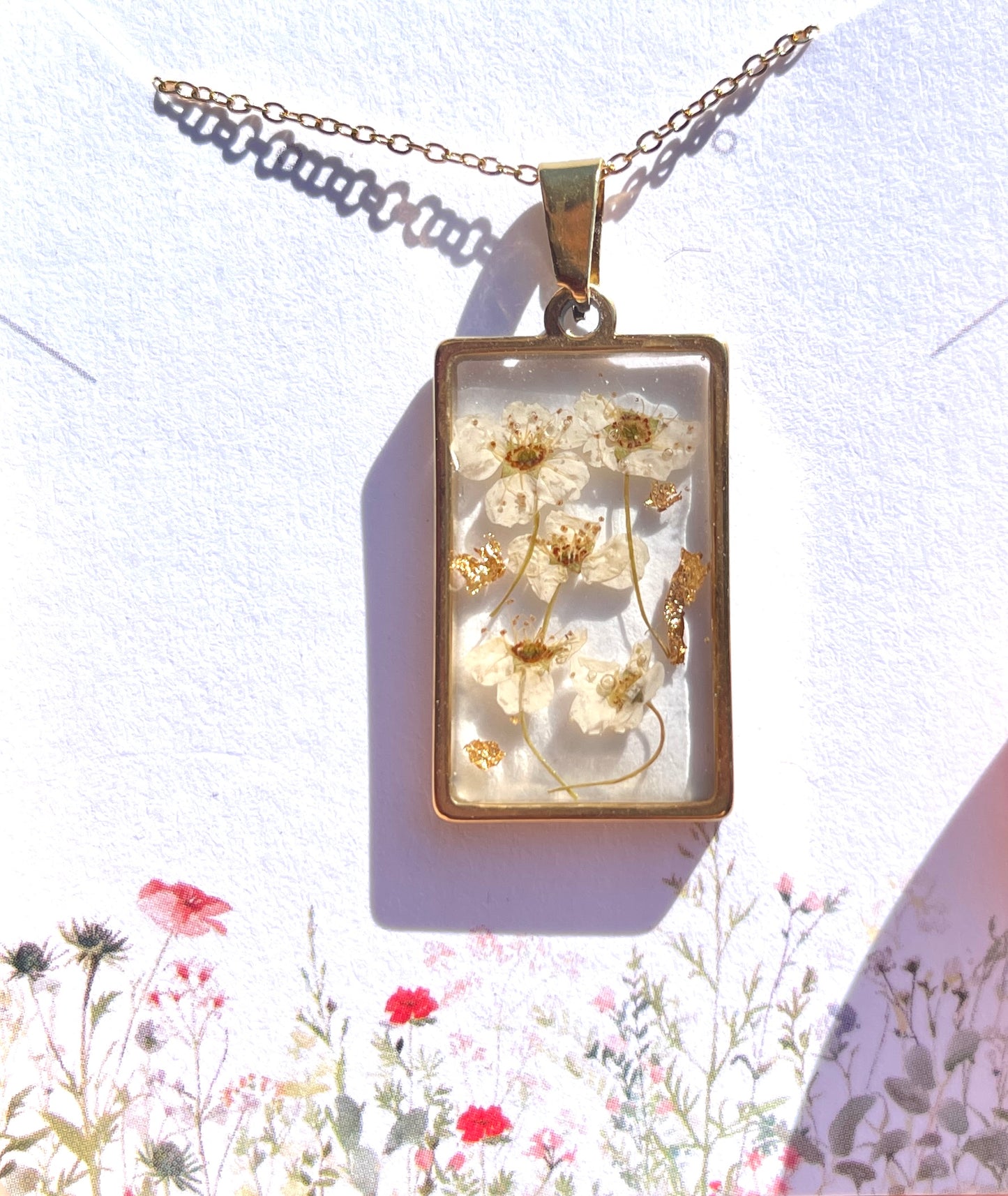 White narcissus flowers with gold flakes